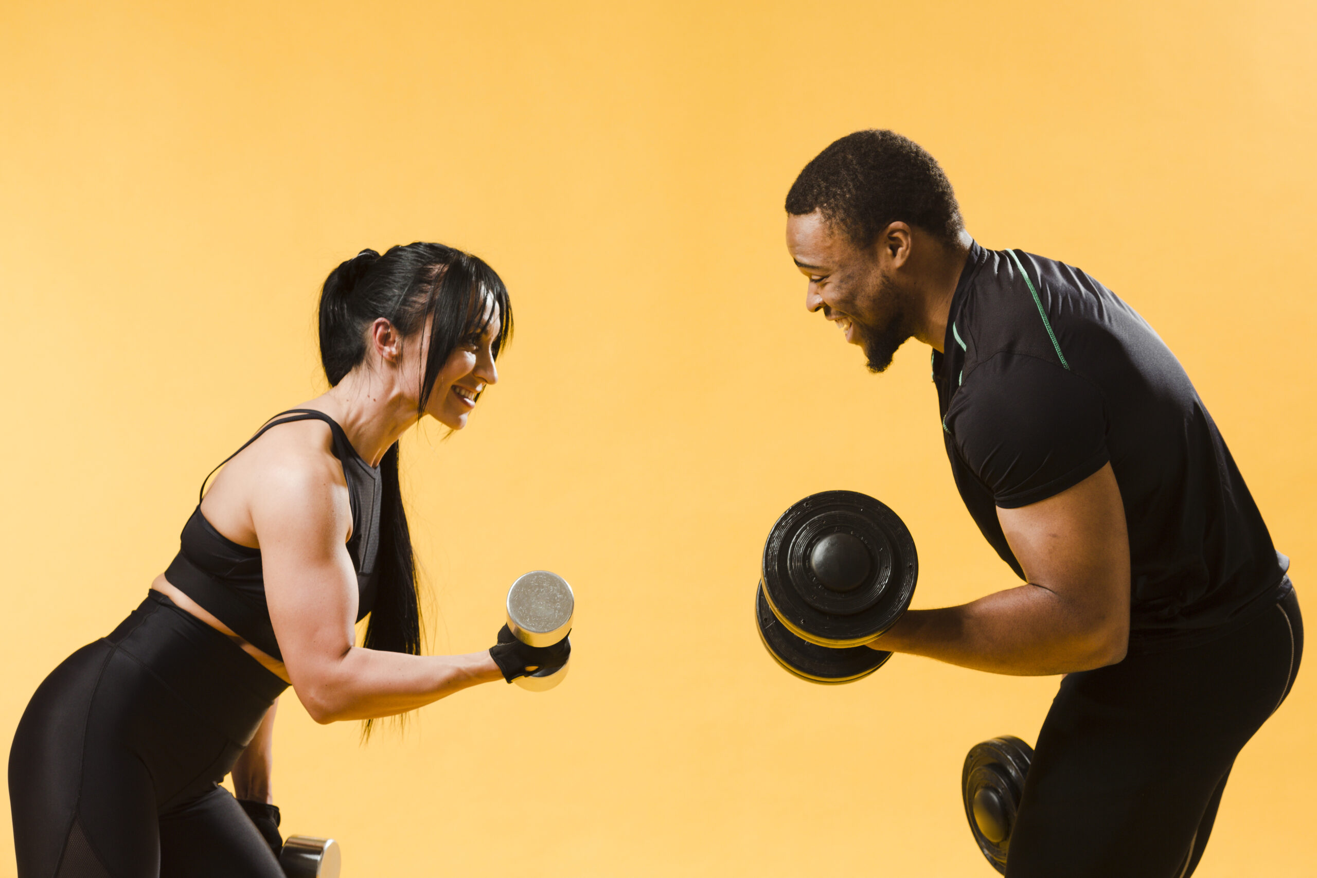side-view-athletes-holding-weights